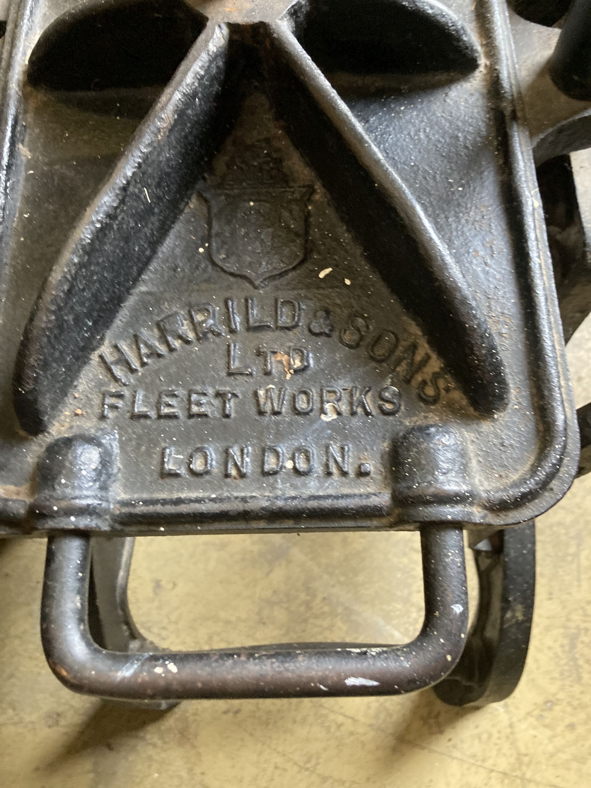 A Harrild and Sons cast iron printers press, with later brass plaque - F.W. Woodruff & Co. Ltd., width 44cm, depth 74cm, height 86cm